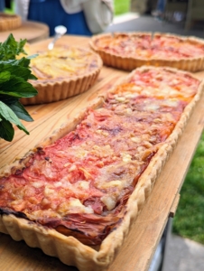 Here's another in a long rectangular shape. Tomato tarts are made using juicy slices of tomato layered with grated cheese in a pâte brisée pastry crust.