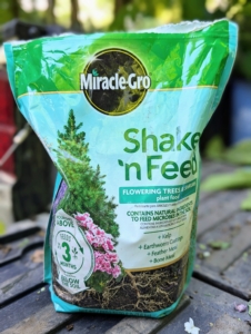 We use Scotts Miracle-Gro Shake 'n Feed, which is an all-purpose plant food containing bone meal, earthworm castings, feather meal, and kelp to support root development and strength.