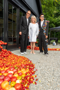 It was a lovely day for a summer party at the home of Dr. Evan Goldstein and Andy Yu. Here I am with Evan and Andy shortly after arriving. (Photo by Charles Wills)