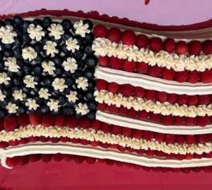 This double white sheet cake is decorated with 13 stripes and 50 stars. I used two to three pints each of red raspberries and blueberries. I also used three batches of Swiss Meringue Buttercream, which makes about five cups. All the recipes are on MarthaStewart.com