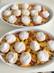 Here they are all ready to go into the oven. I made two, so the recipe was doubled. Cobblers, crisps, buckles, and crumbles are all fruit desserts that are similar but have different toppings and textures. Cobbler has a top crust made of biscuit or pie dough, and usually no bottom crust.