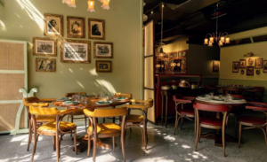 The restaurant is divided into three different sections including a lounge, a dining area, and a kitchen. Many of the photos and decorations are authentic and were brought here from India. (Photo courtesy of Bungalow)