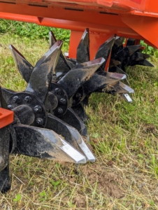 The tines on an aerator are prongs that are driven into the ground to create holes that improve soil health and lawn health. These solid tines break up compaction and improve air pockets. These do not remove soil cores.
