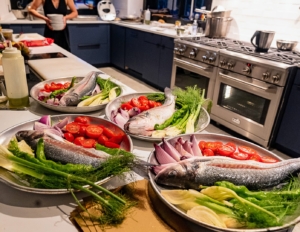 Fish and vegetables are plated individually before cooking outdoors. (Photo by Charles Wills)