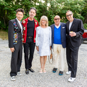 Do you recognize who I am standing next to in this photo? On my left is Clive Davis, the great music impresario. We are joined by designer Greg Schriefer, Andy, and Evan. (Photo by Charles Wills)