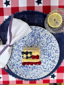 Use red, white, and blue ribbon as a simple napkin holder.