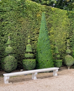 The topiaries and hedges are meticulously maintained.