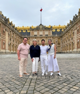 Here I am joined by my group - Roy Tin, Ben Levine, and Judy Morris. This is the grand courtyard and front of the Royal Palace.