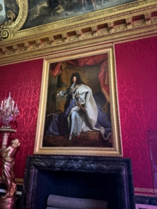 Here’s Louis XIV – this time in a painting showing his high heeled shoes, garters, and ermine robes.