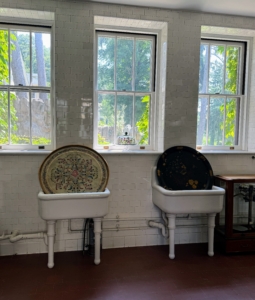 Here are two large farm sinks with beautiful views of the gardens.