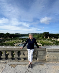 Here I am with a view of the gardens and Orangerie behind me.