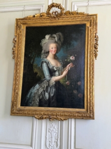 This is a portrait of Maris -Antoinette. In 1774, King Louis XVI offered his wife a palace of her own called Petit Trianon on the grounds of Versailles.