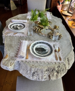 Here is one of the smaller faux bois dining tables dressed with brass and ferns.