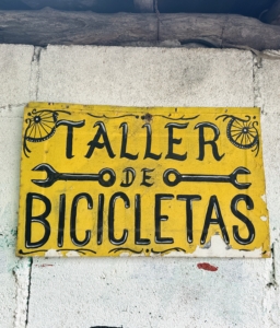 Matt loves all the colorful, handmade signs around Tulum. This one is on a building housing a bike repair shop.