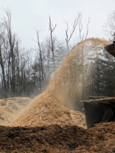 Once a year, I call in a tub grinder and crew to grind all that organic matter. It is done in a back field of my farm. This photo was taken in February.