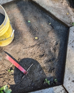 The area is cleaned of debris and clumps of old stone dust.