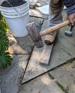 Again, once the paver is returned, it is tamped down securely in place.