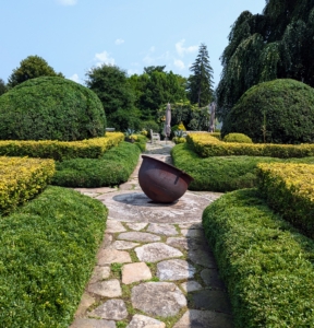 And here is a look at all four quadrants with my antique sugar pot in the center. Sugar kettles were used on 19th century Louisiana plantations for the production of sugar. In the winter, I use it as a fire pit when entertaining. The terrace looks great. Thanks Phurba.