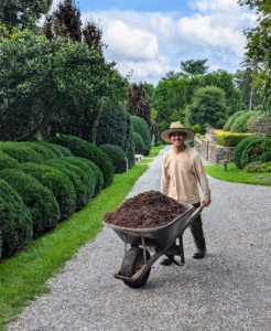 This week, my outdoor grounds crew foreman, Chhiring Sherpa, is mulching the herbaceous peony bed.