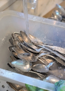 First, Elvira wets all the pieces to be cleaned in warm water. Be mindful of using water that is too cold or too hot as silver can react to extreme temperature changes over time.