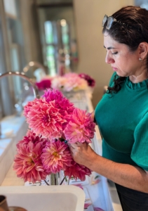 Enma selects the largest and most striking flowers to be the focal point of the arrangement and then adds other blooms to fill surrounding spaces.