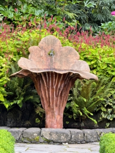 I also captured a photo of this Chanterelle Fountain with Persicaria 'Golden Arrow' behind it, which is native to the Himalayas. Tiny, rose-red to white flowers bloom June through September on narrow, long-stalked spikes.