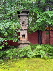 The Abby Aldrich Rockefeller Garden is enclosed by a high pink stucco wall. The wall is capped with orange tiles imported from China.