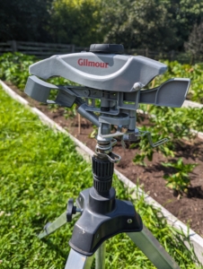 When ready to use, the collar of these tripod sprinklers can be adjusted for partial to full circle coverage. The controls are just under the sprinkler head.