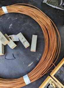 Pete uses small scraps of wood to make these end blocks. And of course, they're painted my signature "Bedford Gray." Heavy gauge copper wire is available at hardware stores. It is malleable, corrosion resistant, and easily recyclable.