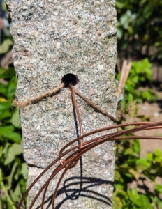 Jute twine was used temporarily. The hole is big enough to fit several lengths of wire or twine.