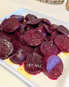 For my salad, I boiled the beets, removed the skins, and sliced them uniformly.