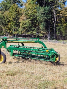 Next, it’s time to make the windrows, which are rows of hay raked up and shaped before being baled. Here is Phurba pulling the bar rake and making windrows from the tedded hay.