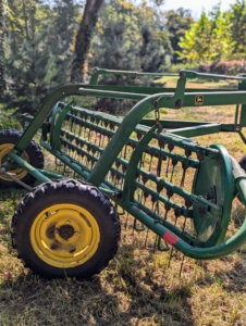 The bar rake, also known as a basket rake is hydraulically driven. This rake allows for consistent movement across the fields making well-shaped windrows, or rows of hay.