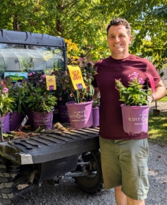 Ryan also places some of the new phlox in the garden. It's always a good idea to position the potted plants first before planting in order to visualize best locations and experiment with design layouts.