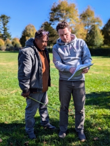 Pete and Ryan go over my sketches and instructions for planting the boxwood.