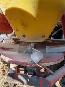 In the back of the unit is the control for how much of the pelleted lime is released – it is important to lock this in place, so the lime is distributed properly. These are slinger blades that help to direct the lime as it is thrown.