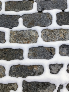 And the cobblestones in the courtyard outside my stable are also coated with snow.