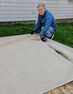 Fernando is working on the air conditioner pits. I keep all my air conditioners in large pits, where they are well hidden behind each house. These air conditioner pits are covered with industrial strength plastic, plywood, and then burlap to protect them from the winter elements.