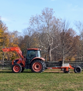 My outdoor grouds crew foreman, Chhiring, uses my Land Pride tow-behind aerator. I am glad to be able to have all the farm equipment we need. The aerator is attached to the Kubota M4-071 tractor.