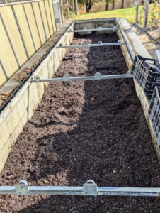 This is one of two large cold frames behind my main greenhouse. A cold frame is a transparent-roofed enclosure, built low to the ground that utilizes solar energy and insulation to create a microclimate suitable for growing or overwintering plants. Historically, cold frames were built as greenhouse extensions tucked against the outer walls with southern exposure outside Victorian glasshouses.