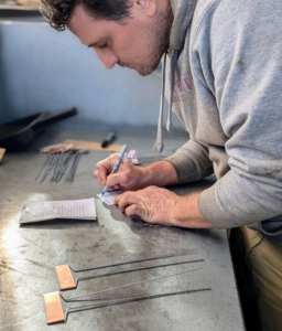 Ryan prepares the labels. It's good to keep varieties identified, so favorites can be grown again the following season.