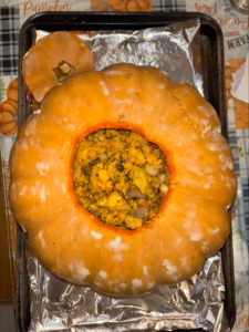 Abby made my Cornbread, Mushroom, and Chestnut Stuffing Filled Roasted Cheese Pumpkin. She says she's made it three years in a row and it's been a hit every time.