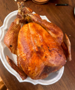 Christian says he tried the parchment turkey but "the absence of an actual staple gun necessitated a late switch to Martha's cheese cloth turkey. it was delicious." 