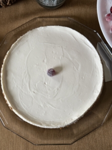 Ryan says his family demands he make this cheesecake every year. It's topped with a layer of sweetened sour cream. Ryan also used a ginger snap crust to make it more seasonal.