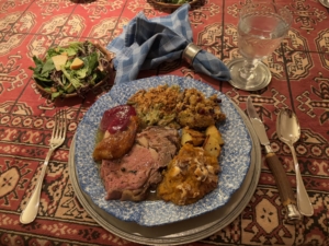 Justin's first plate with standing rib roast, turkey, roasted potatoes, mashed sweet potatoes, cornbread sausage stuffing, homemade cranberry sauce and a fall harvest apple salad.