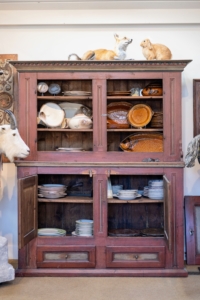 Other items in the store include these dishes and antique cabinet from the boutique Creel and Gow, also in Millbrook. (Photo by Guisela Photo)