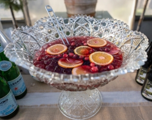 This is my Christmas Punch with pomegranate, cranberry, Cointreau, sparkling water, lemon, and simple syrup. (Photo by Guisela Photo)