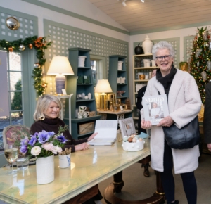 In between signings, I always try to take photos with guests. Here I am with Lois Mander. (Photo by Guisela Photo)