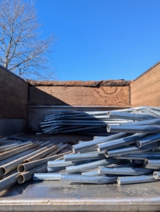 When pipes like these are out this time of year, it can only mean one thing - it's time to burlap. These pipes, which we keep organized in a back field where we store other supplies, are made from rolled galvanized 16 gauge industrial tubing. They are actually the metal parts of greenhouse hoop houses. I also use them for the framing needed for the protective burlap covers. In all, hundreds of ground stakes, purlin pipes, connectors, nuts, and bolts are used for the project.