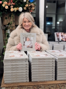 I am so pleased with how my book is doing. It is a wonderful collection of recipes, personal stories, and great photographs selected by me from my own archives. Here I am before putting pen to paper and signing every one of these books.